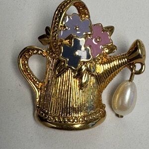 Vintage 1992 Avon "Friendship in Bloom" lapel pin. Gold tone watering can.